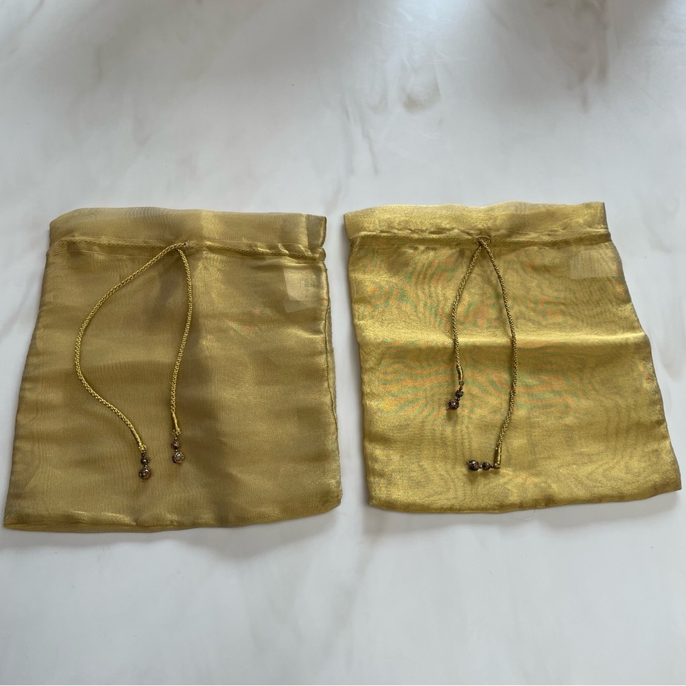 Pair of Bombay Company sheer gold bags